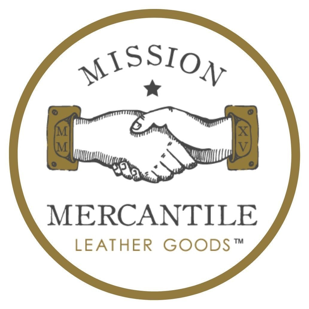 Logo of Mission Mercantile Leather Goods with a handshake illustration.